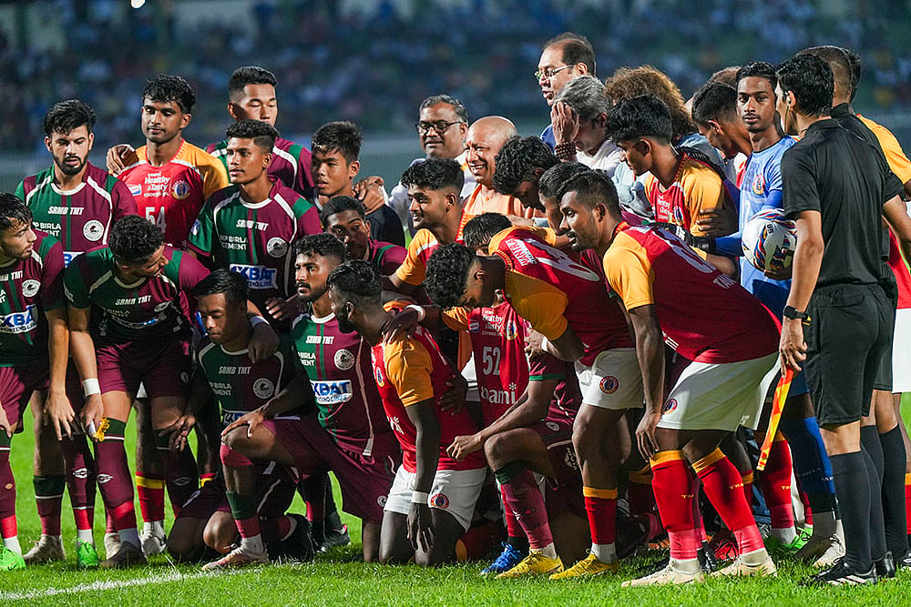 | Photo: PTI/Nand Kumar : Mohun Bagan vs East Bengal exhibition match: Uttar Pradesh Chief Minister Yogi Adityanath poses for group photo